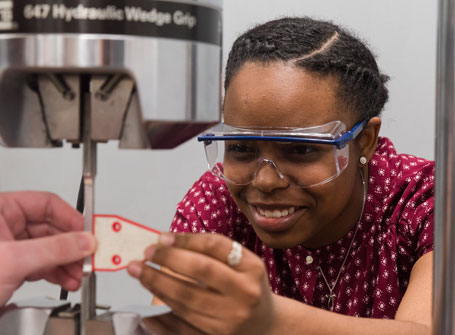 Female Engineering Student wearing safety goggles