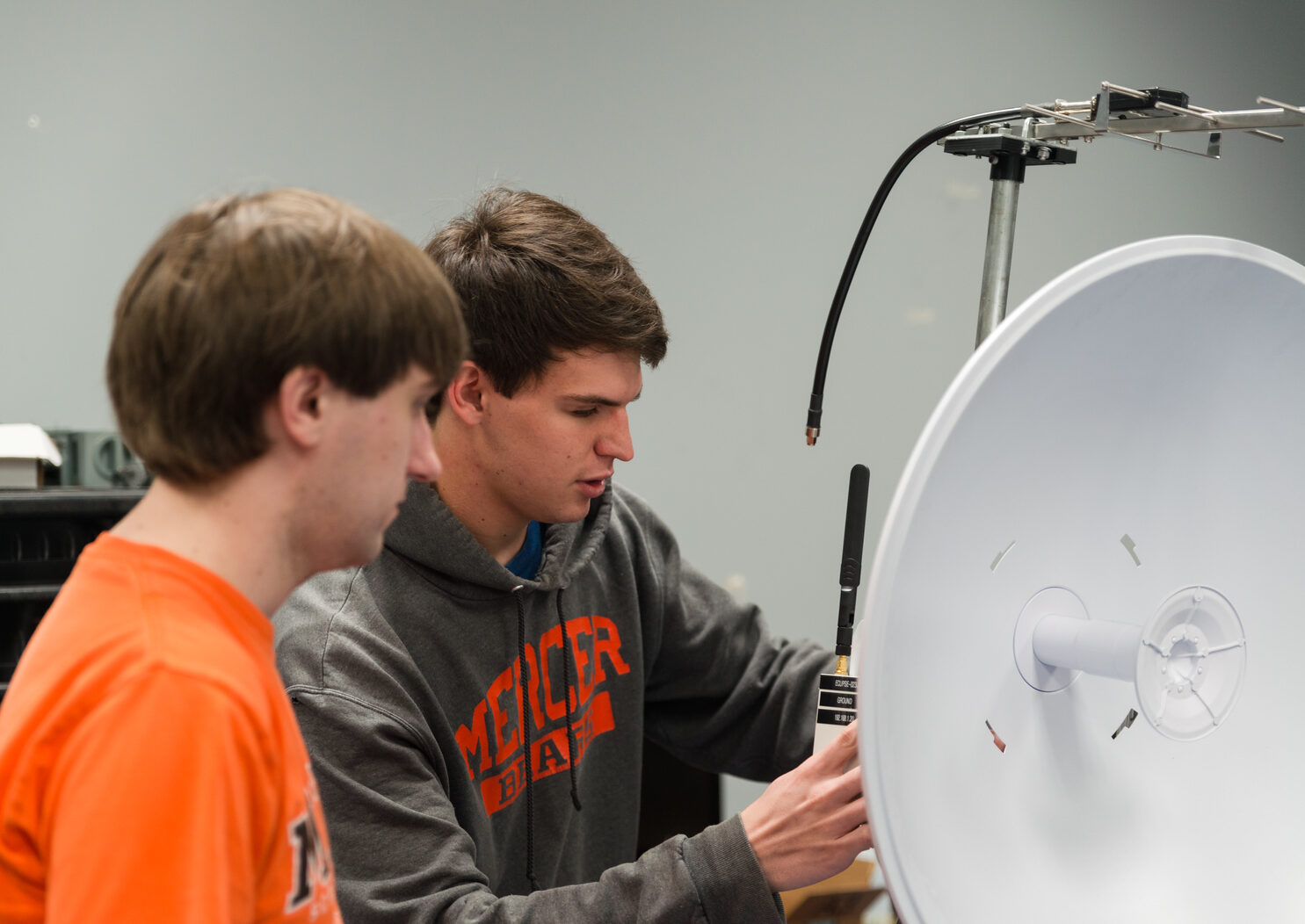 Two Mercer University students in an engineering lab working on a project